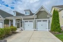 Beautiful Bayside Carriage home overlooking pond with screened for sale in Selbyville Delaware Sussex County County on GolfHomes.com