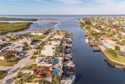 Wake up every morning to shimmering canal views, step out onto for sale in New Port Richey Florida Pasco County County on GolfHomes.com