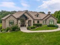 This fabulous custom home built by Starr Homes sits nestled on a for sale in Overland Park Kansas Johnson County County on GolfHomes.com