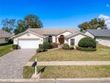 Pavers on the driveway and entry welcome you to this lovely for sale in Hudson Florida Pasco County County on GolfHomes.com