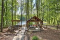 Welcome to your dream lakefront home! Built in 1999 and nestled for sale in Jasper Georgia Pickens County County on GolfHomes.com