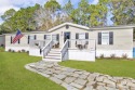 This charming 3 bedroom 2 1/2 bathroom manufactured home offers for sale in Orange Beach Alabama Baldwin County County on GolfHomes.com