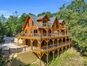 Classic log cabin, conveniently located behind the gates of for sale in Lake Lure North Carolina Rutherford County County on GolfHomes.com