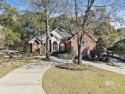 Welcome to this elegant 4-bedroom, 3.5-bathroom home with serene for sale in Fairhope Alabama Baldwin County County on GolfHomes.com