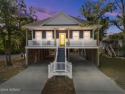 Ever wish every day felt like a vacation? This beautifully for sale in Oak Island North Carolina Brunswick County County on GolfHomes.com