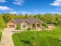A custom-built home on a beautiful and completely private for sale in Johnston Iowa Polk County County on GolfHomes.com