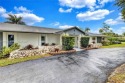 Nestled on a spectacular, tree-lined site in a quiet, low for sale in Hollywood Florida Broward County County on GolfHomes.com