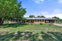 This rare 4-bedroom, single-story home is situated on nearly one for sale in Llano Texas Llano County County on GolfHomes.com