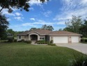 Stunning Rainbow Springs Country Club Estates home on corner lot for sale in Dunnellon Florida Marion County County on GolfHomes.com
