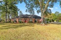 Welcome to this beautifully maintained four-bedroom, two-bath for sale in North Pace Florida Santa Rosa County County on GolfHomes.com