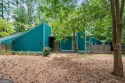 Amazing location on large wooded lot overlooking Huddleston Pond for sale in Peachtree City Georgia Fayette County County on GolfHomes.com