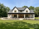 Discover this stunning custom-built farmhouse nestled on 3.27 for sale in Marshville North Carolina Union County County on GolfHomes.com