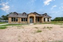 Magnificent custom home with oversized lot on the golf course in for sale in Devine Texas Medina County County on GolfHomes.com
