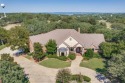 Welcome to this stunning custom home nestled at the end of a for sale in Runaway Bay Texas Wise County County on GolfHomes.com