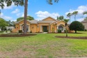 Stunning Custom-Built Palmwood Courtyard Home Nestled In The for sale in Spring Hill Florida Hernando County County on GolfHomes.com