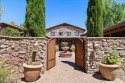 From the moment you enter through the stately iron gate into the for sale in Prescott Arizona Yavapai County County on GolfHomes.com