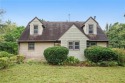 This private and secluded two story home sits on a huge, treed for sale in Belton Missouri Cass County County on GolfHomes.com