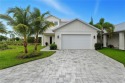 Set on a premier corner lot within the exclusive Seahorse for sale in Naples Florida Collier County County on GolfHomes.com