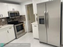 LOVELY RENOVATED CORNER CONDOMINIUM!! UPDATED NEW KITCHEN for sale in Davie Florida Broward County County on GolfHomes.com