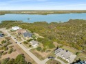 Discover the beauty of Joe Pool Lake with this one-of-a-kind lot for sale in Grand Prairie Texas Dallas County County on GolfHomes.com