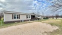 Embrace the charm of lakeside living with this impressive for sale in Quitman Texas Wood County County on GolfHomes.com