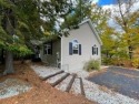 Bask in the summer sun while sitting on the sandy Sebago Lake for sale in Casco Maine Cumberland County County on GolfHomes.com