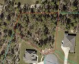 Welcome to 60 Corkwood Court, an expansive .87-acre homesite for sale in Freeport Florida Walton County County on GolfHomes.com