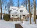 Offering Lake Michigan views, this fully furnished charming for sale in Petoskey Michigan Emmet County County on GolfHomes.com