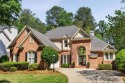 Prepare to indulge in resort-style living in this meticulously for sale in Alpharetta Georgia Fulton County County on GolfHomes.com