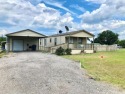 Your fishing retreat awaits at Lake Fork! This charming for sale in Quitman Texas Wood County County on GolfHomes.com