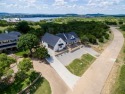 Live elevated at this new built 3-bedroom, 2-bathroom retreat for sale in Possum Kingdom Lake Texas Palo Pinto County County on GolfHomes.com