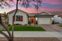 Sleek, modern house with an open-concept floor plan that offers for sale in Buckeye Arizona Maricopa County County on GolfHomes.com