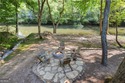 Riverfront living at it's finest with 110 feet of river frontage for sale in Ellijay Georgia Gilmer County County on GolfHomes.com