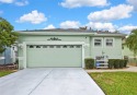 Welcome to this warm and inviting home located in The Groves for sale in Land O Lakes Florida Pasco County County on GolfHomes.com