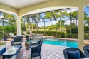 Casual elegance meets golfers' paradise! Sweeping golf views for sale in Vero Beach Florida Indian River County County on GolfHomes.com