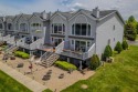 Stunning End-Unit Condo on Lake Lancer -- A Rare Lakeside Gem for sale in Gladwin Michigan Gladwin County County on GolfHomes.com