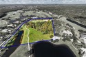 RARE BUILDABLE LOT - WATER ON TWO SIDES - GOLF COURSE VIEWS - for sale in Naples Florida Collier County County on GolfHomes.com