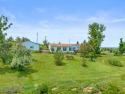 Welcome to your next home! Nestled on a sprawling 4.02-acre for sale in Belle Fourche South Dakota Butte County County on GolfHomes.com
