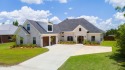 A Wow Factor Home!  This exquisite 5-bed, 2.5-bath custom brick for sale in Lynn Haven Florida Bay County County on GolfHomes.com