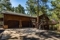 Nestled among towering pines in the prestigious Perry Park golf for sale in Larkspur Colorado Douglas County County on GolfHomes.com