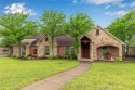 Nestled amidst the serene beauty of mature oak trees, this home for sale in Lipan Texas Parker County County on GolfHomes.com