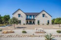 Welcome to The Showstopper! This gorgeous Custom home welcomes for sale in Cleburne Texas Johnson County County on GolfHomes.com