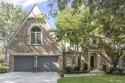 Discover a distinguished Tudor-style home by builder Jim Lambie for sale in Leawood Kansas Johnson County County on GolfHomes.com