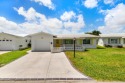 Nestled within 55+ Palm Beach Leisureville, this expanded for sale in Boynton Beach Florida Palm Beach County County on GolfHomes.com
