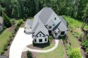 This exceptional golf course home is located in The Manor Golf for sale in Milton Georgia Fulton County County on GolfHomes.com