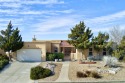 A gated  courtyard entry leads you into this LIGHT FILLED for sale in Albuquerque New Mexico Bernalillo County County on GolfHomes.com