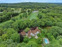 Set on 4.5 idyllic park-like acres overlooking Aspetuck Valley for sale in Weston Connecticut Fairfield County County on GolfHomes.com