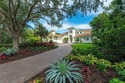 Tucked away on a quiet, tree-lined street in the exclusive for sale in Naples Florida Collier County County on GolfHomes.com