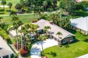 This thoughtfully cared for home offers 3 spacious bedrooms for sale in Atlantis Florida Palm Beach County County on GolfHomes.com
