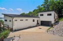 The views from this modernly constructed lakefront home are for sale in Four Seasons Missouri Camden County County on GolfHomes.com